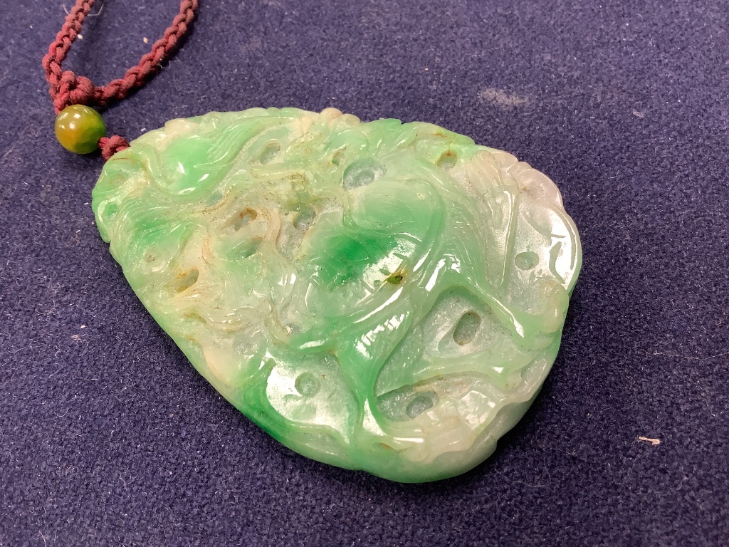 A Chinese jadeite pendant , a pair of bangles, earrings and a cricket pendant